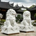 Pair of white marble Chinese foo dog statues, hand carved natural stone guardian lion sculptures for garden and courtyard