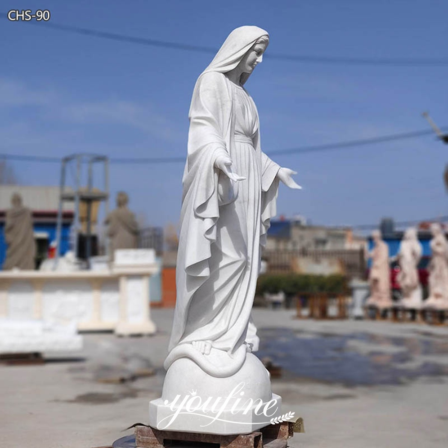 the left of marble mary statue