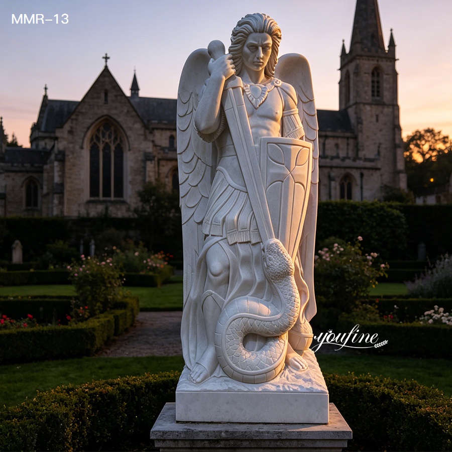 White marble St Michael the Archangel statue defeating serpent, set in front of a church at sunset
