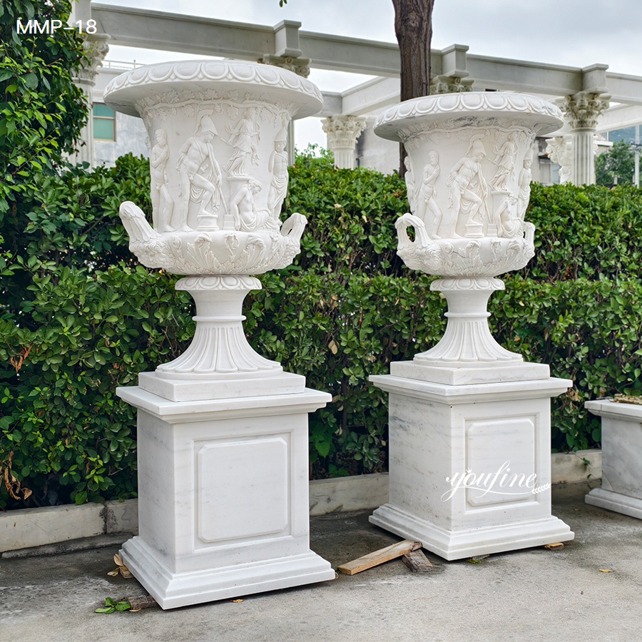 Outdoor white marble planter urn with classical relief sculpture