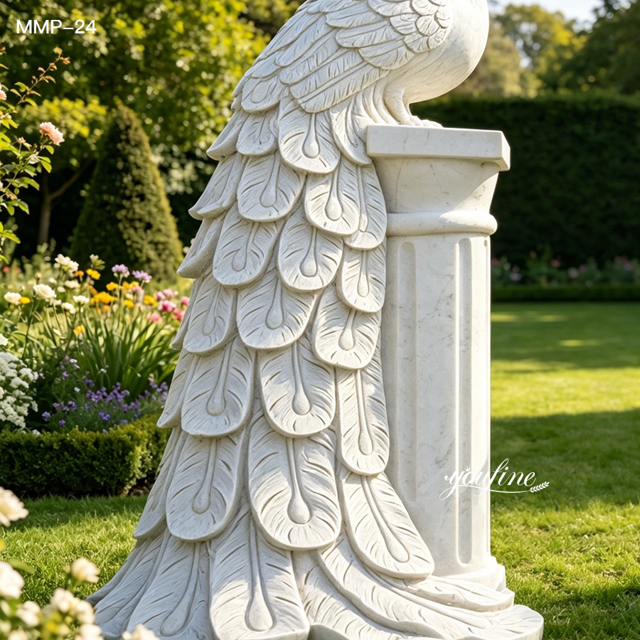Close-up of white marble peacock flower pot with hand-carved feather details