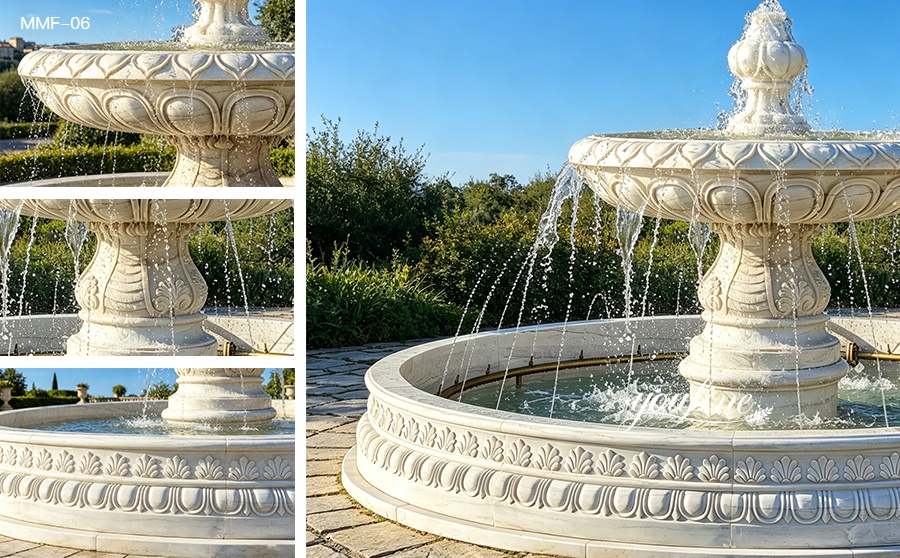 close-up detail of a marble fountain with water flowing from the upper bowl into the basin