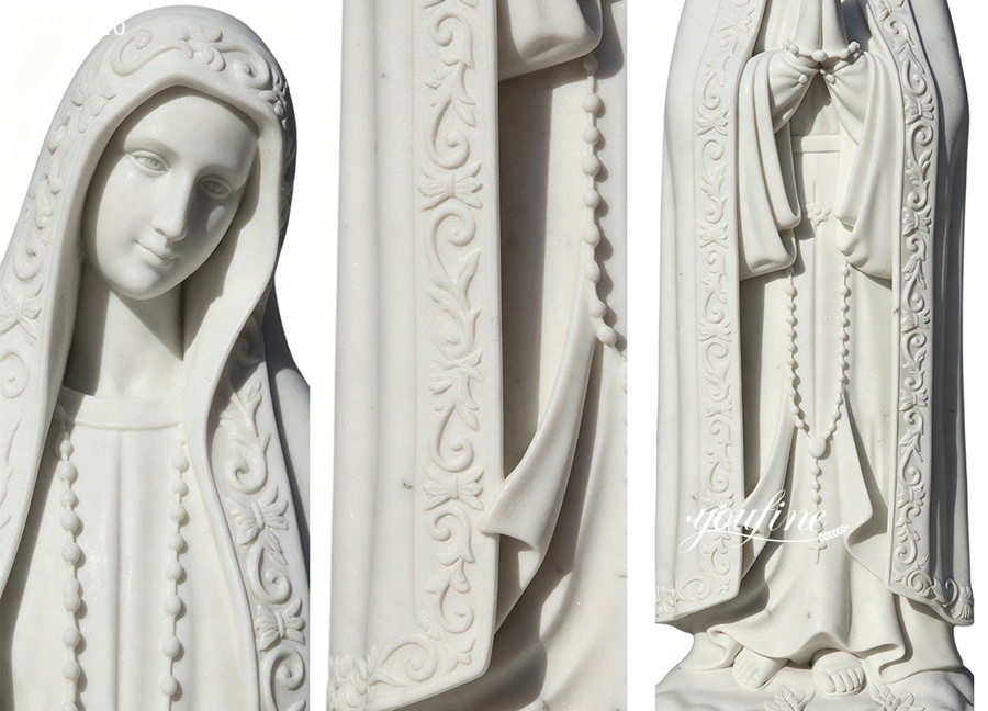 Our Lady of Fatima marble statue details, close up of hand carved marble Virgin Mary's face, rosary and robe carvings, intricate details of religious marble sculpture