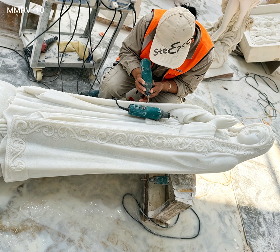Our Lady of Fatima marble statue production process, factory worker carving white marble Virgin Mary sculpture, hand carving process of religious marble statue in our factory