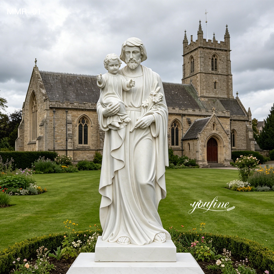 Pure white marble St Joseph statue with the infant Jesus, standing in a church courtyard, perfect for outdoor religious decoration.