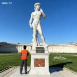 Life‑size marble David statue with red marble base for garden
