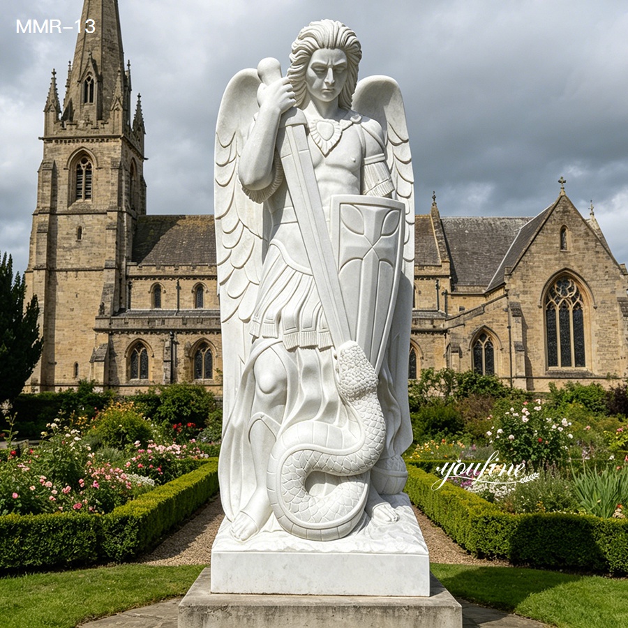 St Michael the Archangel marble statue in a landscaped church garden, symbolizing the triumph of good over evil