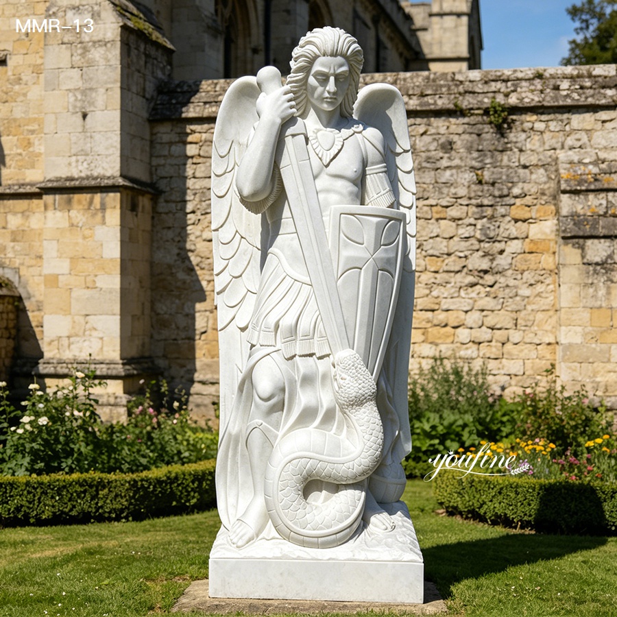 Large outdoor marble St Michael the Archangel statue, handcrafted with exquisite details in a historic church garden