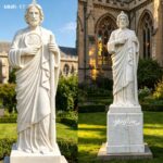 Full view of a white marble St. Jude statue with a sturdy custom base, displayed in a peaceful church garden.