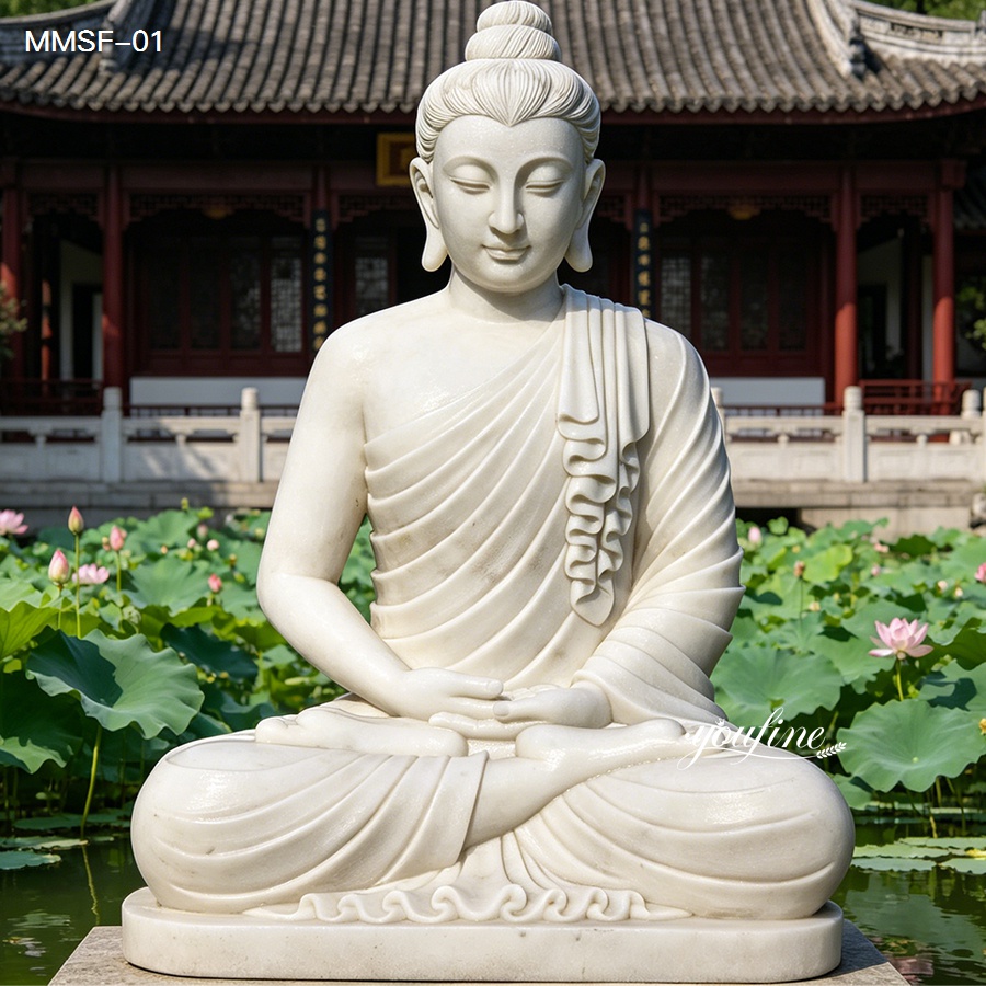 Large white marble Buddha statue seated with lotus pond view