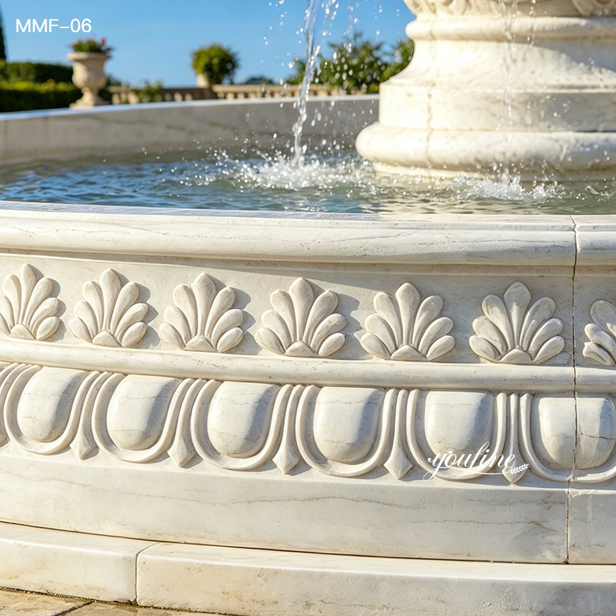 carved basin detail of one tier white marble fountain