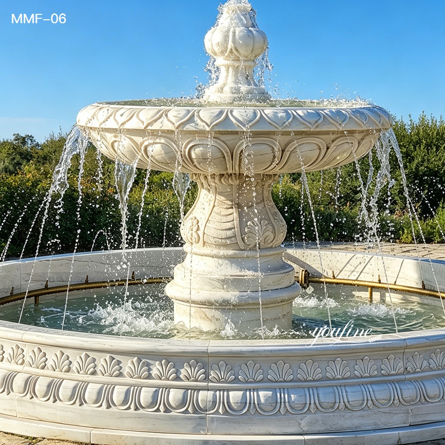 one tier white marble fountain with water flow in outdoor garden