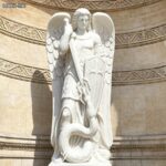 st michael statue stand front the churches