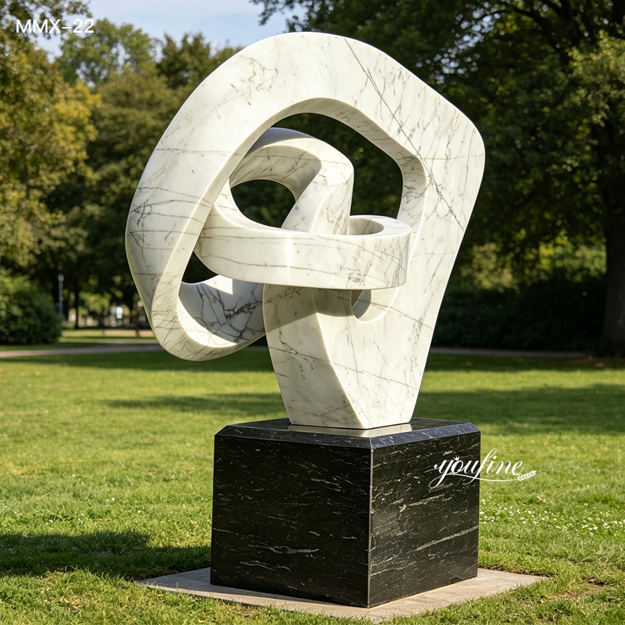 Modern abstract sculpture with minimalist circular form, veined marble art for public spaces