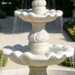 Close-Up of Water Flowing from a Four-Tier Marble Fountain