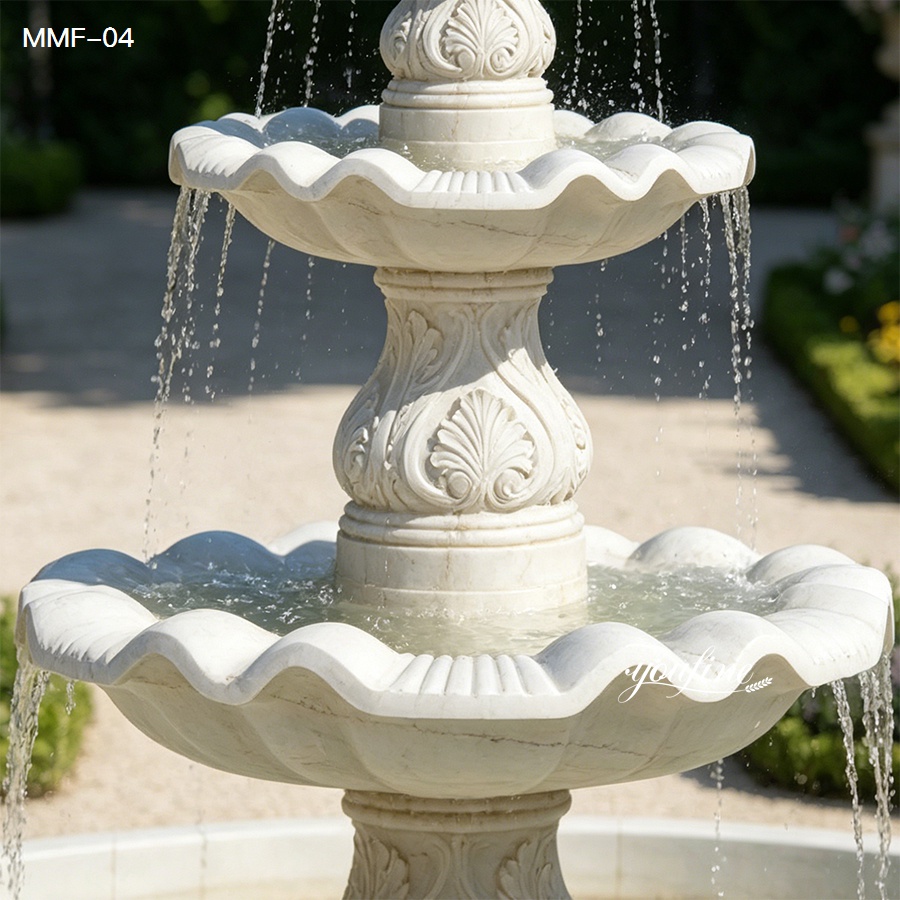 Close-Up of Water Flowing from a Four-Tier Marble Fountain