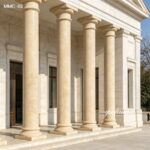 Cream natural marble pillars for sale, clean finish tapered columns complementing modern classical building designs