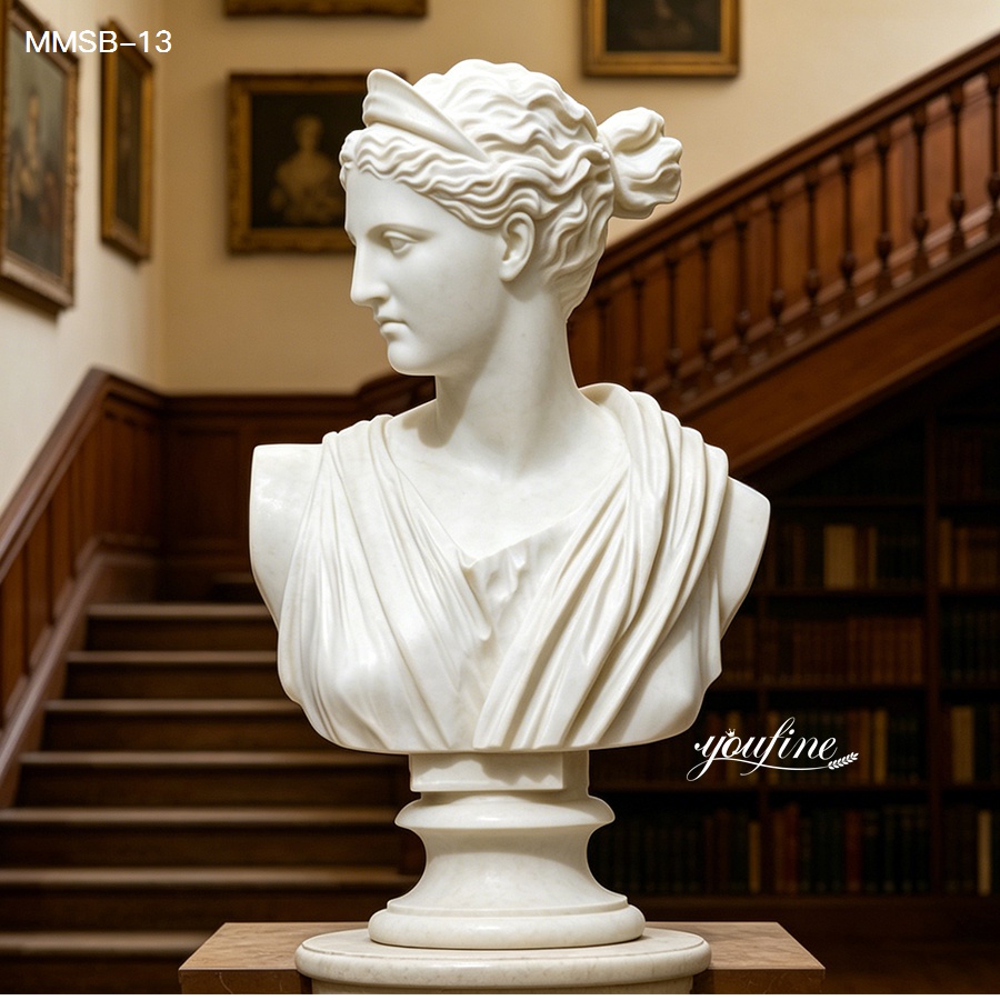 Marble bust of Diana the Huntress displayed in a classic library with bookshelves and stairs