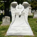 hand carved weeping angel statue with laurel wreath pedestal details