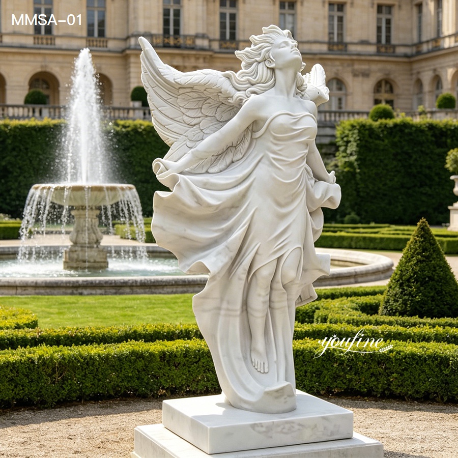 Elegant white marble angel statue with flowing dress and wings displayed in a formal garden setting