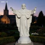 White marble Jesus Christ statue with open arms, church garden religious sculpture