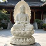 large marble buddha statue with backlight, outdoor mountain temple setting, serene expression