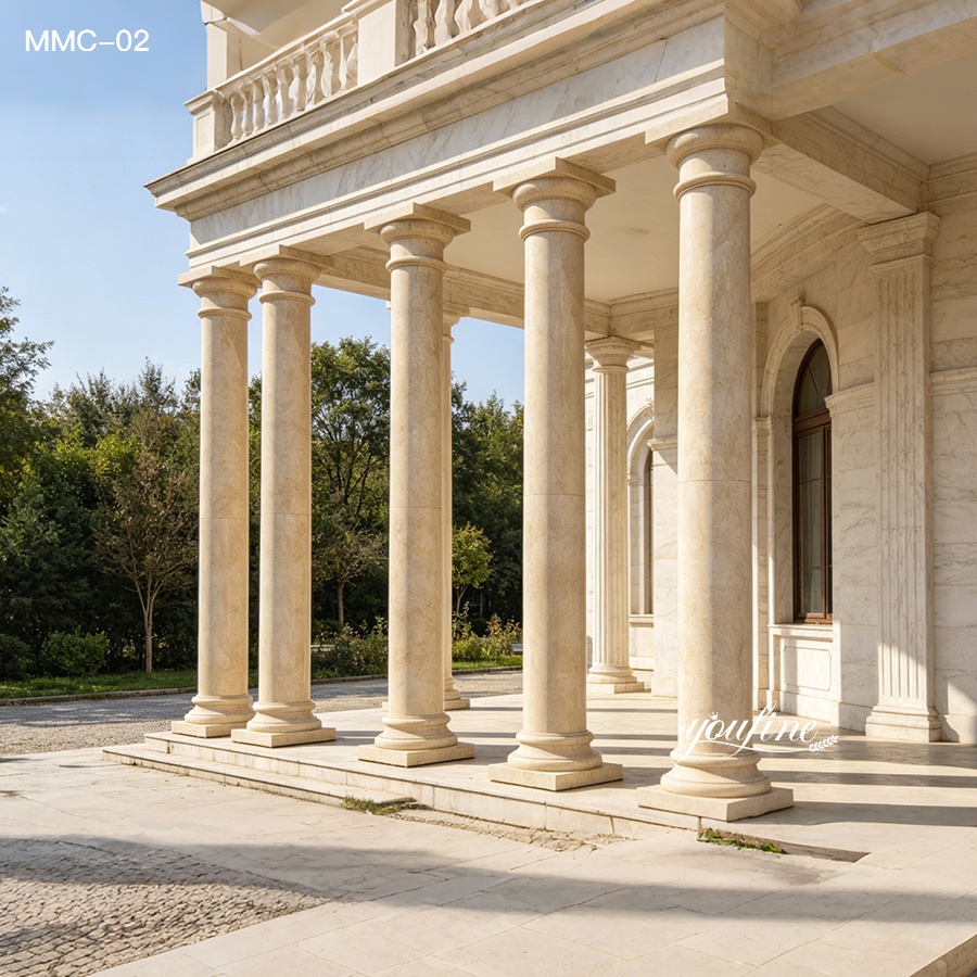 Real photo of natural beige marble pillars for sale, full-size tapered columns installed on a classical building facade