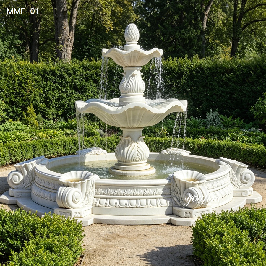 hand carved marble fountain with layered water effect in garden