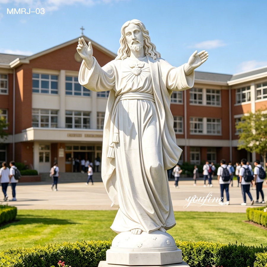 white marble Jesus statue placed in a school courtyard landscape
