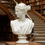 Close-up of hand-polished marble bust of Diana the Huntress, showing facial details and drapery