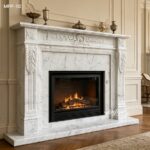 Traditional white Carrara marble fireplace surround with full hand-carved laurel leaf details in a home setting