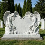 Outdoor-ready white marble double angel heart headstone in cemetery