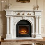 Ornate white carved marble fireplace surround with classical details