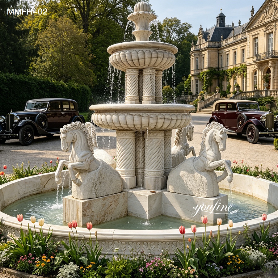 Finished white marble fountain with horses, installed at a luxury European-style estate.
