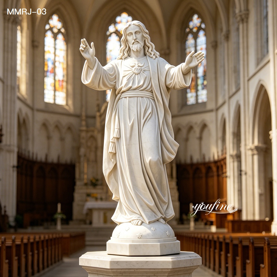 white marble Jesus statue displayed inside a church interior
