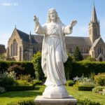elegant white marble Jesus garden statue in front of church buildings