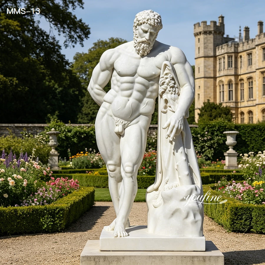 Full body natural marble Hercules statue displayed in formal flower garden near vintage mansion
