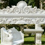 Close-up view of hand carving details on swan arm and floral back of marble garden bench for sale