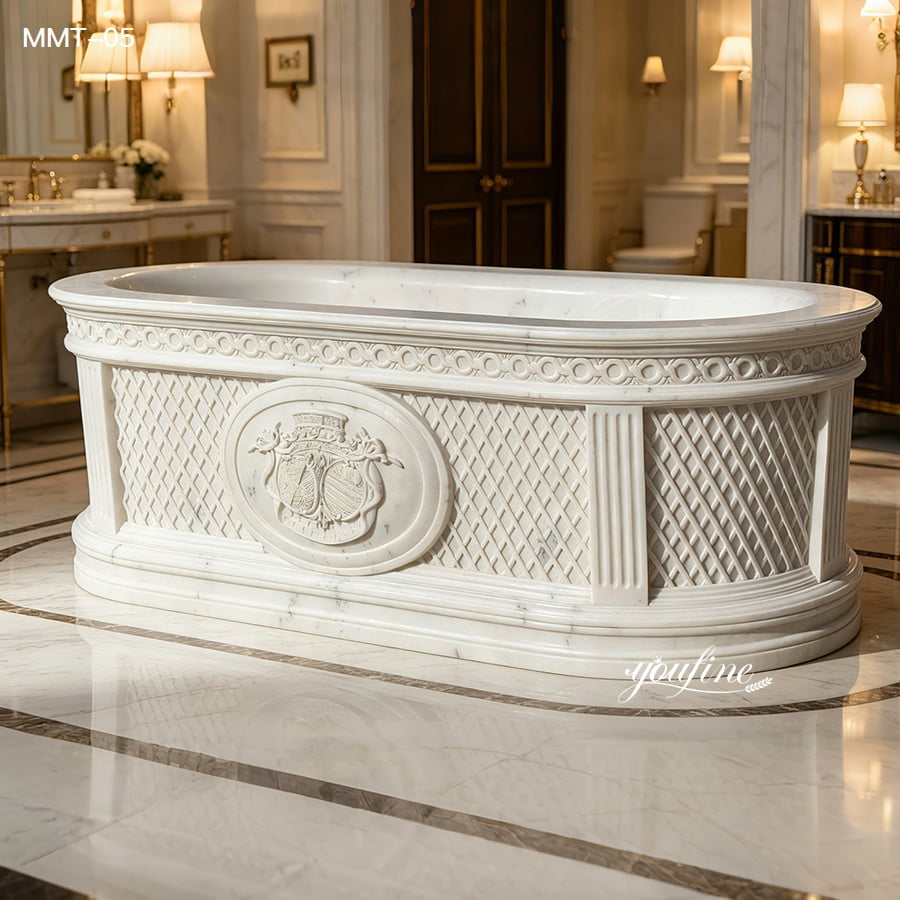 Front view of solid hand carved marble bathtub with embossed crest and woven side carving details