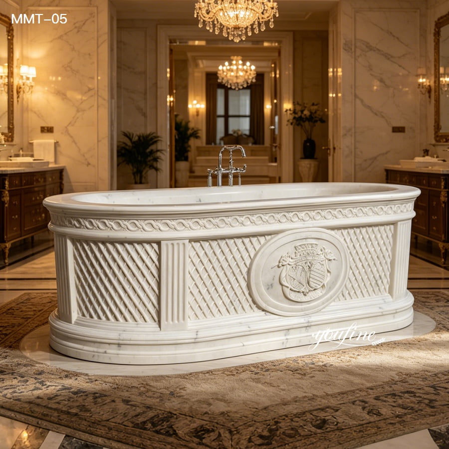 Hand carved marble bathtub placed under crystal chandelier inside grand vintage styled marble bathroom