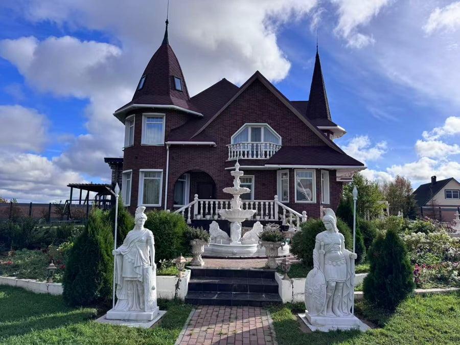 Hand carved white marble multi-tier fountain paired with garden lady sculptures, real installation at Russia luxury villa courtyard