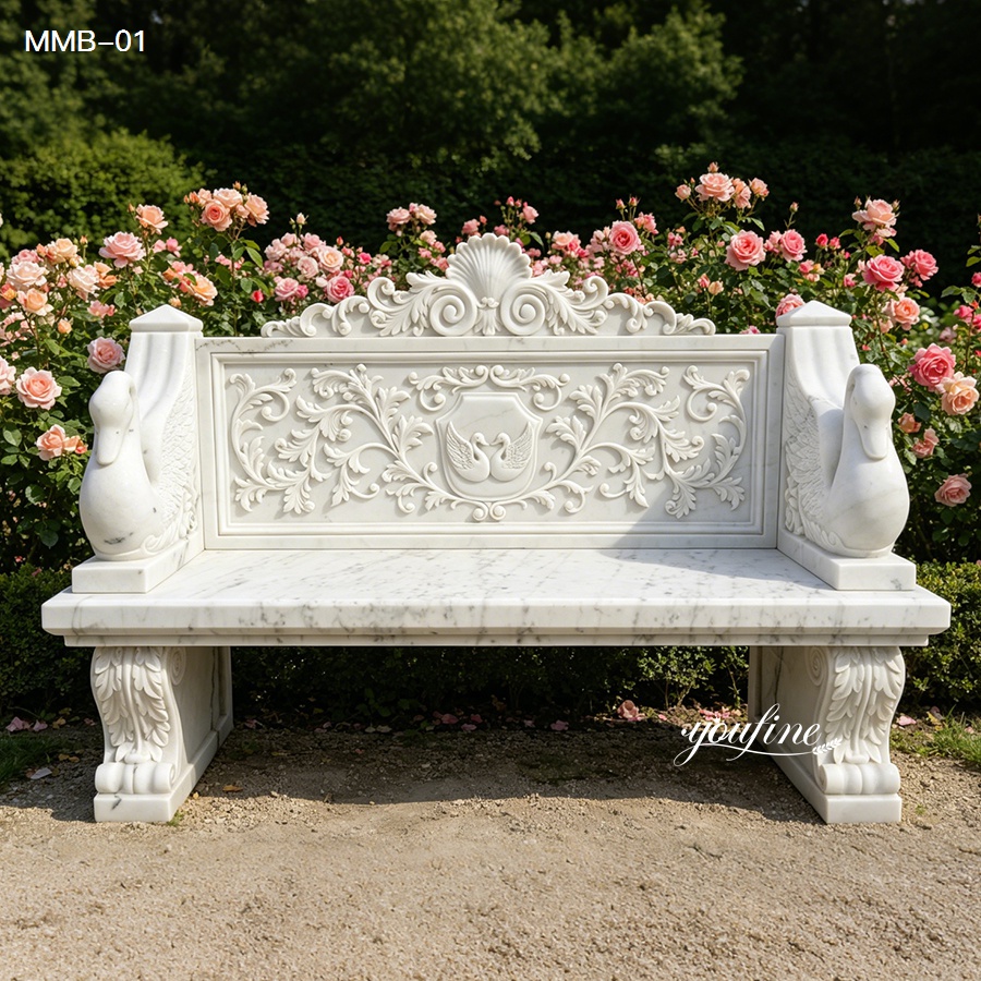 Solid white natural marble garden bench for sale with swan armrest, outdoor stone seating next to garden rose flowers