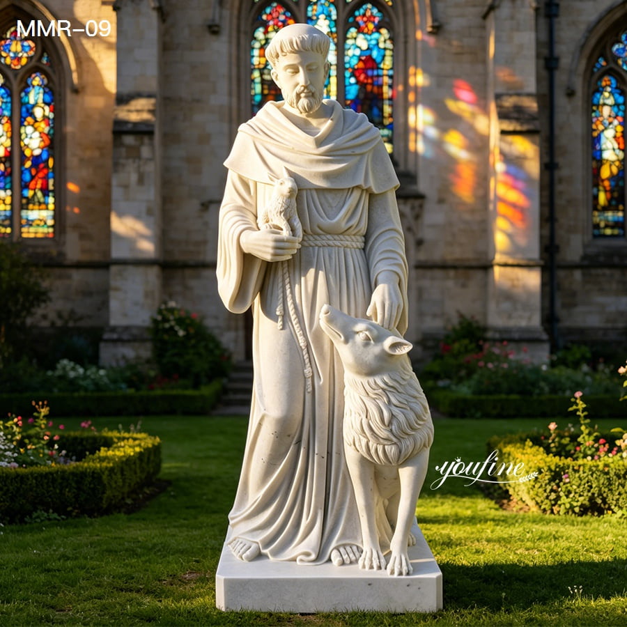Marble St Francis of Assisi statue placed in a sunny garden