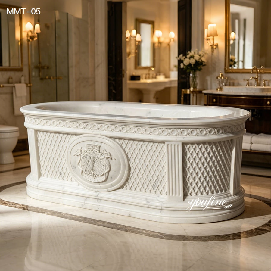 Oval freestanding hand carved marble bathtub with classical European carved details in luxury bath room
