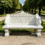 Hand carved swan arm white marble garden bench for sale, ornate floral back stone bench placed on garden trail