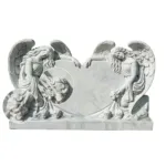 Hand-carved white marble sculpture featuring two angels with delicate wings leaning on a heart centerpiece, showcasing fine craftsmanship.