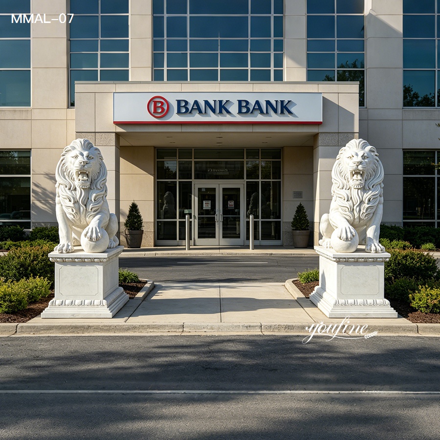 Entrance of a bank building with two intricately carved white marble lion statues on pedestals, symbolizing strength and stability.