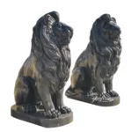Two intricately carved black marble lion sculptures with regal manes, showcasing craftsmanship and luxury, on pedestal bases.