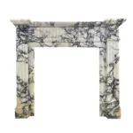 Sophisticated marble fireplace surround featuring intricate black veins, fluted columns, and a polished decorative frame.
