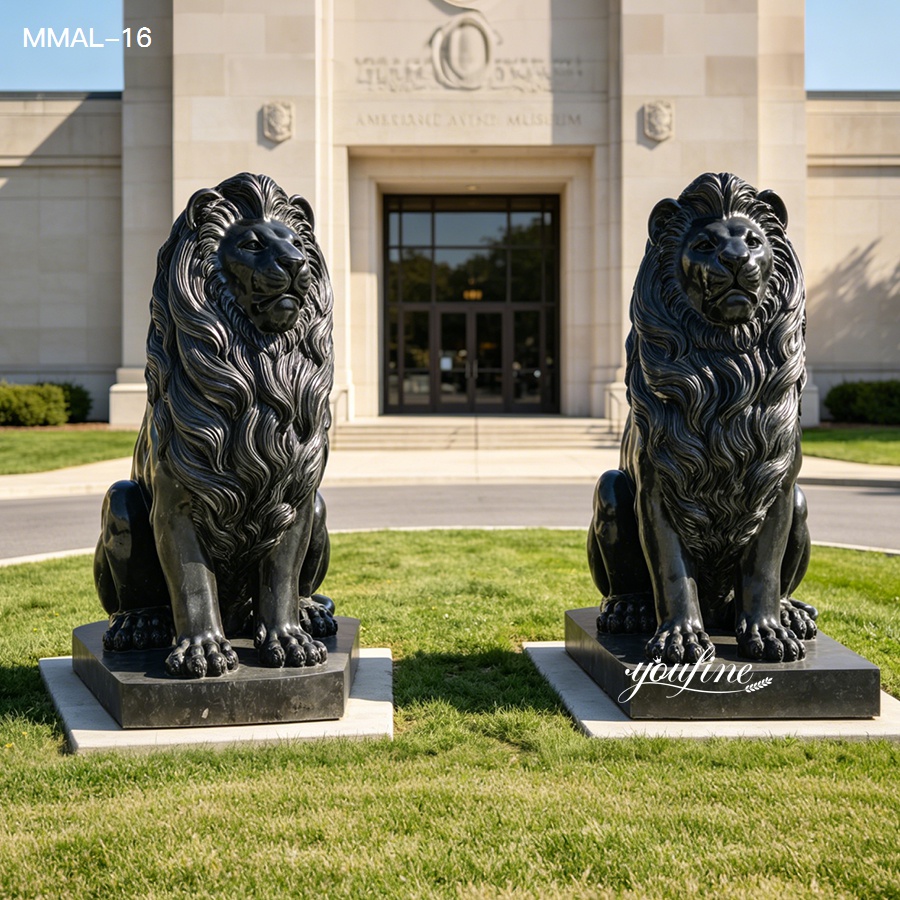 Pair of large bronze lion statues placed symmetrically at the entrance of a museum, set on grassy surroundings with a grand facade.